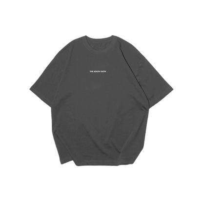Dark gray t-shirt with white text on a matching gray background